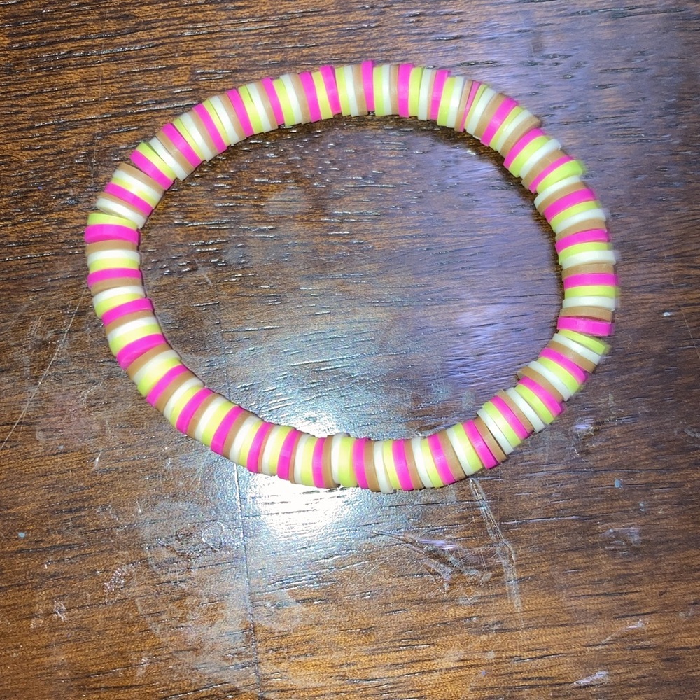 This is a hand made bracelets colors are pink neon yellow and brown
